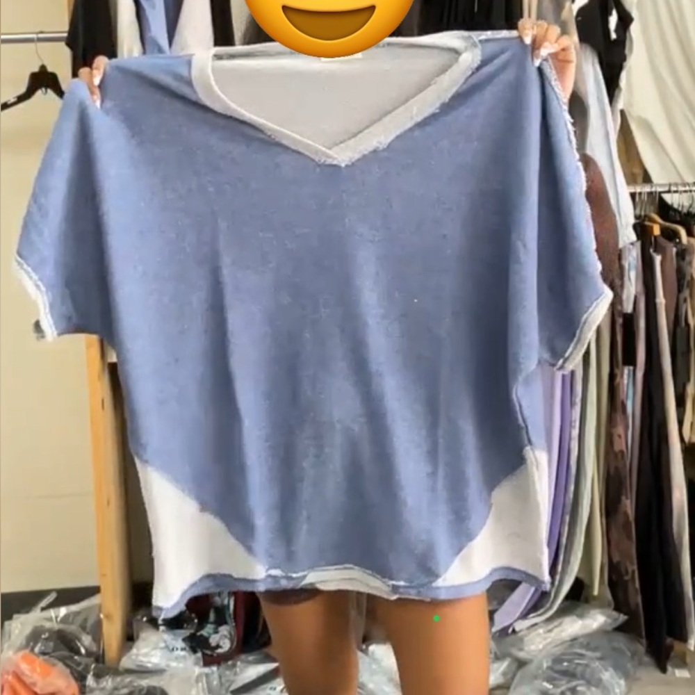 Blumin brand! This Two Tone Short Sleeve V-Neck Top combines comfort and style!